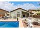 Backyard pool with nearby patio and yard area at 42491 W Chisholm Dr, Maricopa, AZ 85138