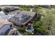 Bird's-eye view of a home with solar panels, a pool, a patio, and lush landscaping at 43650 W Snow Dr, Maricopa, AZ 85138