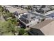 Aerial view of a home featuring solar panels, a balcony, a patio, and a sparkling pool at 43650 W Snow Dr, Maricopa, AZ 85138