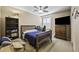 Bedroom with cozy furniture, neutral carpet, and a bright window at 43650 W Snow Dr, Maricopa, AZ 85138