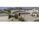Charming two-story home with a three car garage, complemented by low maintenance landscaping at 43650 W Snow Dr, Maricopa, AZ 85138