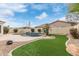 Lush backyard with a blue-tile pool, grassy area, and landscaped features offers a private oasis for enjoyment at 4522 S Wildflower Pl, Chandler, AZ 85248