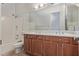 Bathroom features double sinks, wood cabinets, bathtub with tile surround, and a separate toilet area at 4522 S Wildflower Pl, Chandler, AZ 85248