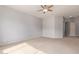 Large bedroom offers plush carpeting, ample space, and a ceiling fan at 4522 S Wildflower Pl, Chandler, AZ 85248