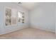 Bright bedroom features neutral carpet, light-colored walls, and plantation shutters allowing natural light at 4522 S Wildflower Pl, Chandler, AZ 85248