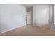 Cozy bedroom features neutral carpet, light walls, and a closet with sliding doors for storage at 4522 S Wildflower Pl, Chandler, AZ 85248