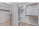Walk-in closet features built-in shelving and ample storage space at 4522 S Wildflower Pl, Chandler, AZ 85248