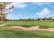 Expansive golf course view with a sand trap, lush greenery, and blue skies, perfect for sports enthusiasts at 4522 S Wildflower Pl, Chandler, AZ 85248