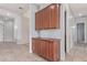 Hallway featuring wooden cabinets for extra storage at 4522 S Wildflower Pl, Chandler, AZ 85248