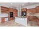 Spacious kitchen featuring granite countertops, kitchen island, and dark wood cabinets at 4522 S Wildflower Pl, Chandler, AZ 85248