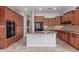 Beautiful kitchen with granite counters, a center island, and stainless steel appliances at 4522 S Wildflower Pl, Chandler, AZ 85248