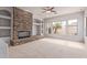 Inviting Gathering room with a stone fireplace, plush carpet, and lots of natural light at 4522 S Wildflower Pl, Chandler, AZ 85248