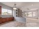 Open living room with stone fireplace, tile floors, and lots of natural light at 4522 S Wildflower Pl, Chandler, AZ 85248