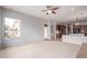 Bright open living area flowing into the kitchen, featuring neutral colors and natural light at 4522 S Wildflower Pl, Chandler, AZ 85248