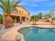 Lush backyard featuring mature trees, a relaxing pool area, and a beautifully landscaped outdoor space at 4582 S Wildflower Pl, Chandler, AZ 85248