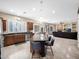 Open kitchen featuring a granite island, stainless steel appliances, and seamless flow into the living area at 4582 S Wildflower Pl, Chandler, AZ 85248