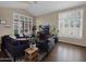 Cozy living room with plush seating, hardwood floors, and bright, natural light at 4582 S Wildflower Pl, Chandler, AZ 85248