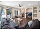 Inviting living room featuring a fireplace, dark wood floors, and a comfortable leather sofa at 4582 S Wildflower Pl, Chandler, AZ 85248