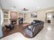 Spacious living room with a cozy fireplace and tile flooring, perfect for entertaining guests at 4582 S Wildflower Pl, Chandler, AZ 85248