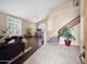 Open-concept living room with wood floors, staircase, and neutral color palette at 4582 S Wildflower Pl, Chandler, AZ 85248