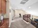Open loft space with built-in cabinetry, neutral carpeting, and a view overlooking the staircase at 4582 S Wildflower Pl, Chandler, AZ 85248