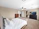 Bright primary bedroom boasts ample space, soft lighting, and a cozy ambiance for restful nights at 4582 S Wildflower Pl, Chandler, AZ 85248