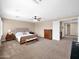 Large primary bedroom showcases soft carpeting, a seating area, and generous space for relaxation at 4582 S Wildflower Pl, Chandler, AZ 85248