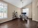 Bright home office featuring hardwood floors, ceiling fan, and abundant natural light at 4582 S Wildflower Pl, Chandler, AZ 85248
