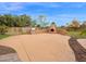 Outdoor kitchen area featuring a built-in grill, fireplace, and a spacious entertainment area at 4582 S Wildflower Pl, Chandler, AZ 85248