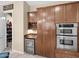 Custom pantry with built-in shelving, providing ample storage and organization for food and kitchen essentials at 4582 S Wildflower Pl, Chandler, AZ 85248