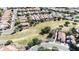 Birds-eye-view showcases a residential neighborhood surrounding a green space with trees and landscaping near community streets at 5222 W El Cortez Trl, Phoenix, AZ 85083