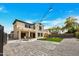 A spacious backyard with patio, gravel area, artificial turf, and ambient string lights for outdoor enjoyment at 5222 W El Cortez Trl, Phoenix, AZ 85083