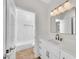 Stylish bathroom featuring a shower-tub combo, modern vanity, and decorative mirror for a modern aesthetic at 5222 W El Cortez Trl, Phoenix, AZ 85083