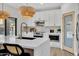 Well-equipped kitchen with stainless steel appliances, pendant lights, and a spacious island at 5222 W El Cortez Trl, Phoenix, AZ 85083