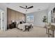 Calm main bedroom with a ceiling fan, panel wall, and a window for natural light at 5222 W El Cortez Trl, Phoenix, AZ 85083