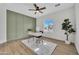 Stylish home office with light green accent wall, and a comfortable chair at 5222 W El Cortez Trl, Phoenix, AZ 85083