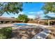 Community park featuring shaded picnic areas, playground, and splash pad for children at 5222 W El Cortez Trl, Phoenix, AZ 85083