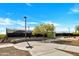 Tennis courts with a modern design, surrounded by lush greenery at 5222 W El Cortez Trl, Phoenix, AZ 85083