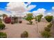 Spacious backyard with a covered patio and mature landscaping offers a great space for outdoor enjoyment at 5445 E Dallas St, Mesa, AZ 85205