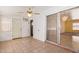 Bonus room features light colored tile floors, light colored walls, a ceiling fan, and sliding glass doors at 5445 E Dallas St, Mesa, AZ 85205