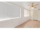 Bonus room features light colored tile floors, light colored walls and a ceiling fan at 5445 E Dallas St, Mesa, AZ 85205