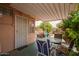 Relaxing covered patio with a table, chairs, and vibrant plants create an ideal outdoor living space at 5445 E Dallas St, Mesa, AZ 85205
