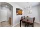 Charming dining room with wood table set and whimsical chandelier lighting at 6626 W Laurel Ave, Glendale, AZ 85304
