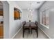 Traditional dining room with a hardwood floors, chandelier and view of the pass through bar at 6626 W Laurel Ave, Glendale, AZ 85304