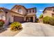 Beautiful two-story home with desert style landscaping and attached garage at 6626 W Laurel Ave, Glendale, AZ 85304