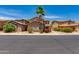 Inviting exterior view of home with well-maintained landscaping and a desert style yard with palm tree at 6626 W Laurel Ave, Glendale, AZ 85304