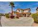 Spacious two-story home boasts a paved driveway and desert landscaping at 6626 W Laurel Ave, Glendale, AZ 85304
