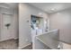 Upstairs landing with laundry closet and access to a room, offering convenience at 6626 W Laurel Ave, Glendale, AZ 85304