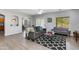 Stylish living room with modern furnishings, hardwood floors, and ample natural light at 6626 W Laurel Ave, Glendale, AZ 85304