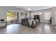 Cozy living room featuring hardwood floors, neutral tones, and sliding glass door at 6626 W Laurel Ave, Glendale, AZ 85304